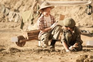 'children playing as archaeologists'