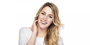 woman smiling touching her jaw